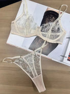 Flatlay view of Ivory Whisper embroidered lingerie showing lace and mesh balance in fabric distribution.
