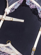 Purple lace lingerie with adjustable elastic straps.
